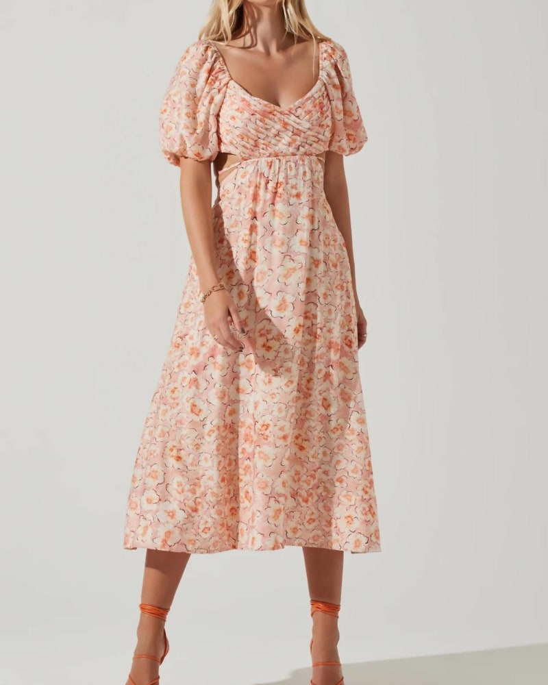 Front of a model wearing a size L Talina Dress In Orange Floral in Orange Floral by ASTR. | dia_product_style_image_id:344728